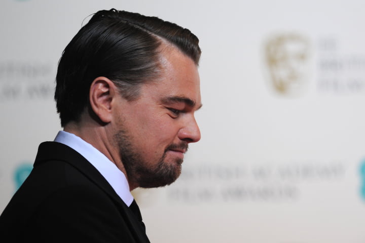 US actor Leonardo DiCaprio poses after presenting an award at the BAFTA British Academy Film Awards at the Royal Opera House in London on February 16, 2014. AFP PHOTO / CARL COURT        (Photo credit should read CARL COURT/AFP/Getty Images)